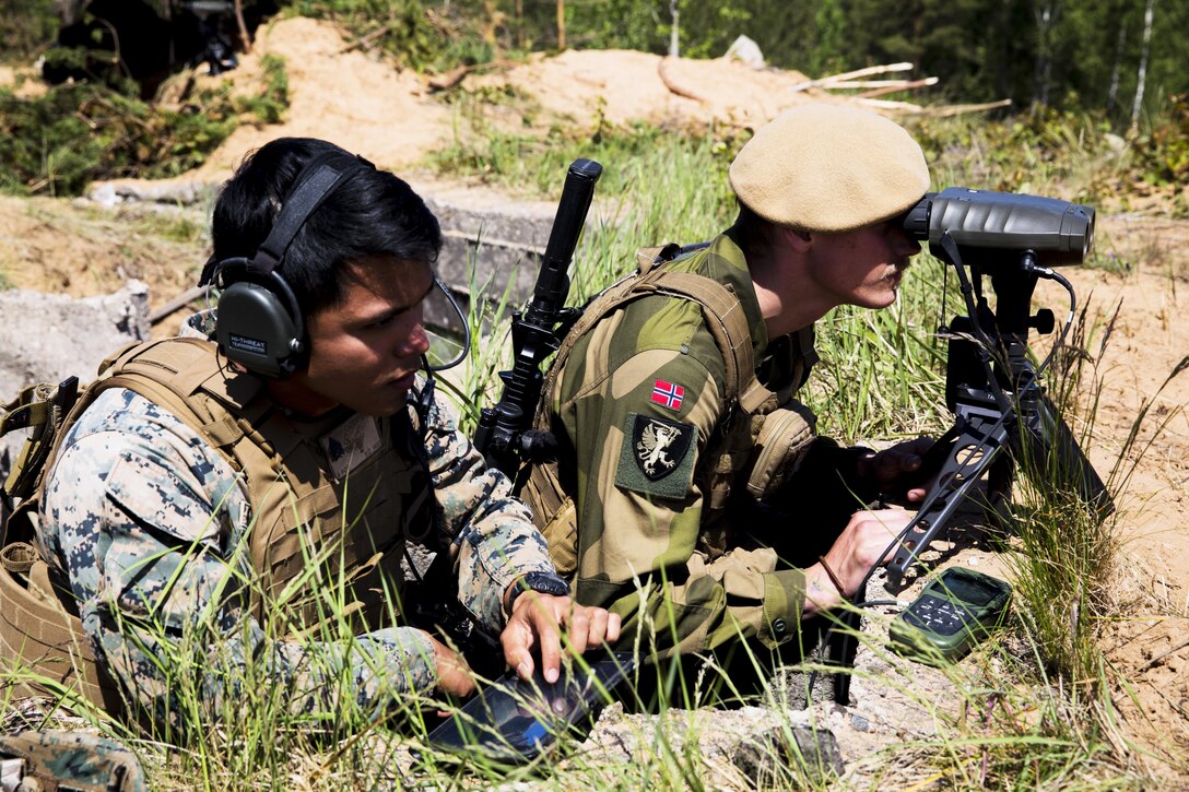 A U.S. Marine, left, assigned to Black Sea Rotational Force 17.1 and a Norwegian soldier participate in exercise Exercise Saber Strike 17 at Adazi Military Base, Latvia, June 9, 2017. Marine Corps photo by Sgt. Patricia A. Morris