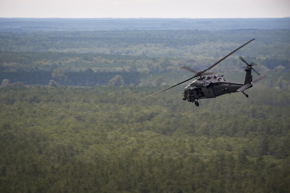 An HH-60G Pave Hawk from the 41st Rescue Squadron flies over Grand Bay Bombing and Gunnery Range during 23d Wing commander Col. Thomas Kunkel’s fini-flight, June 27, 2017, at Moody Air Force Base, Ga. The fini-flight is a long-standing Air Force tradition that occurs when a pilot departs from the base. Upon completion of their final flights, military aviators are hosed down with water or champagne by their family and friends before they depart their unit. (U.S. Air Force photo by Staff Sgt. Ryan Callaghan)