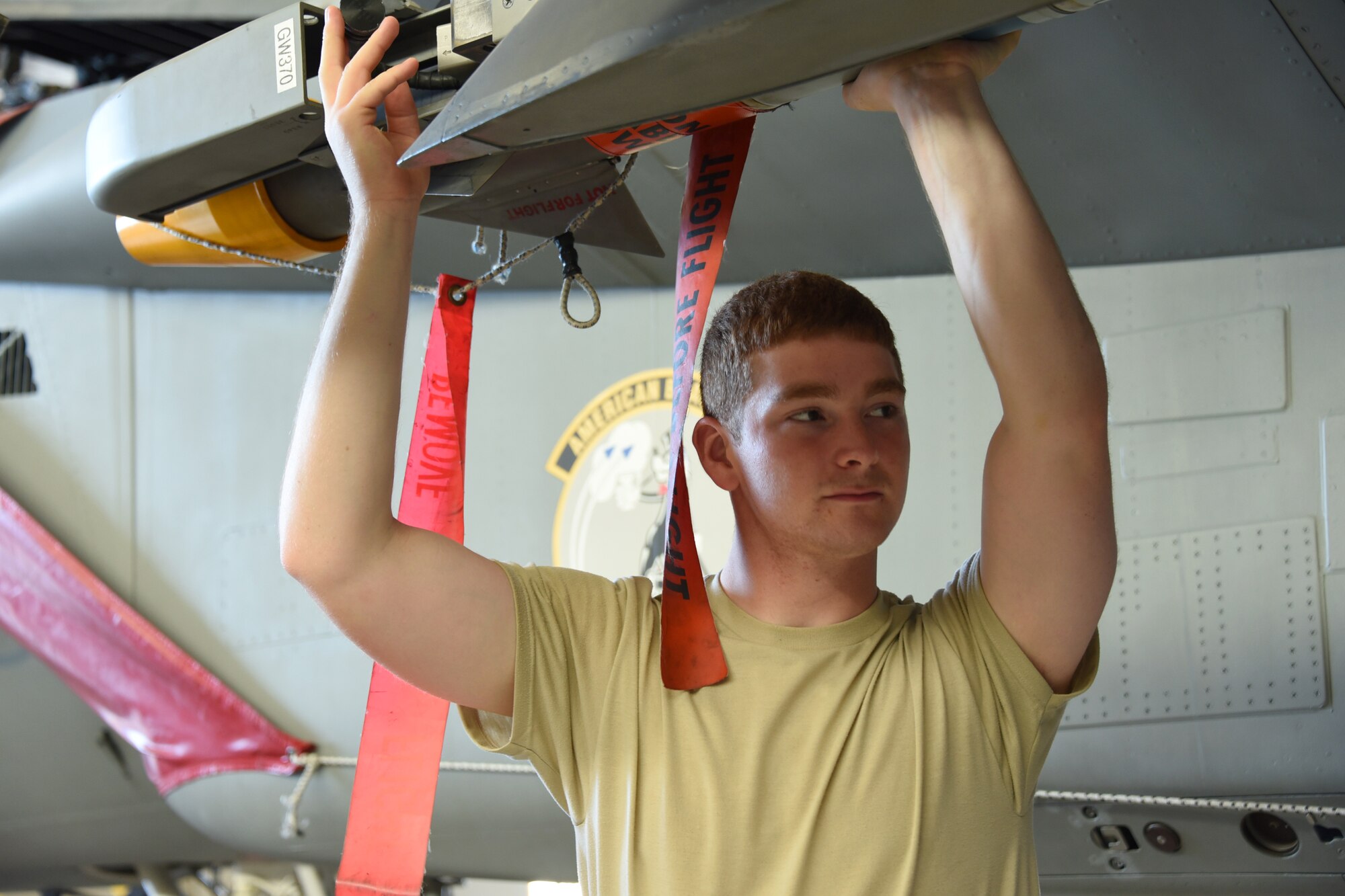 Airman Bradd Hammond 363rd Training Squadron F-15 Eagle aircraft armament systems apprentice student performs functional checks of launch and suspension systems at Sheppard Air Force Base, Texas. Students learn to maintain launch and release devices and also load munitions onto them. (U.S. Air Force photo/Liz H. Colunga)