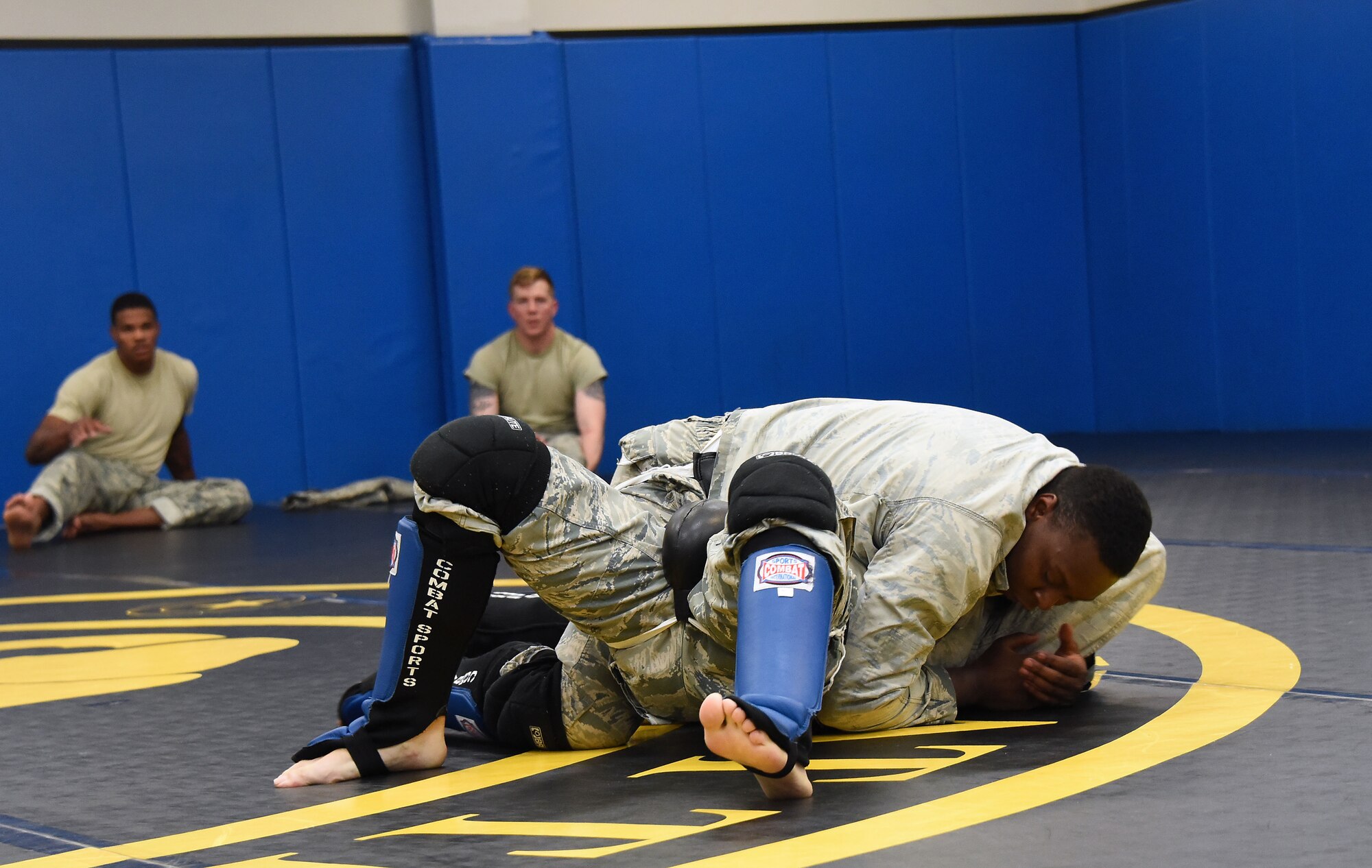 Senior Airman Jerome Scurry (top), 512th Security Forces Squadron reservist, wrestles with another trainee during Phoenix Raven training June 15, 2017, at Joint Base McGuire-Dix-Lakehurst, New Jersey.Raven training includes instruction and realistic practical exercises in antiterrorism and force protection, weapon system security, verbal judo, combatives, tactical baton employments and advanced firearms proficiency. (U.S. Air Force photo/Master Sgt. Jaimie Powell)