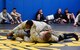 Senior Airman Jerome Scurry (top), 512th Security Forces Squadron reservist, wrestles with another trainee during Phoenix Raven training June 15, 2017, at Joint Base McGuire-Dix-Lakehurst, New Jersey.Raven training includes instruction and realistic practical exercises in antiterrorism and force protection, weapon system security, verbal judo, combatives, tactical baton employments and advanced firearms proficiency. (U.S. Air Force photo/Master Sgt. Jaimie Powell)