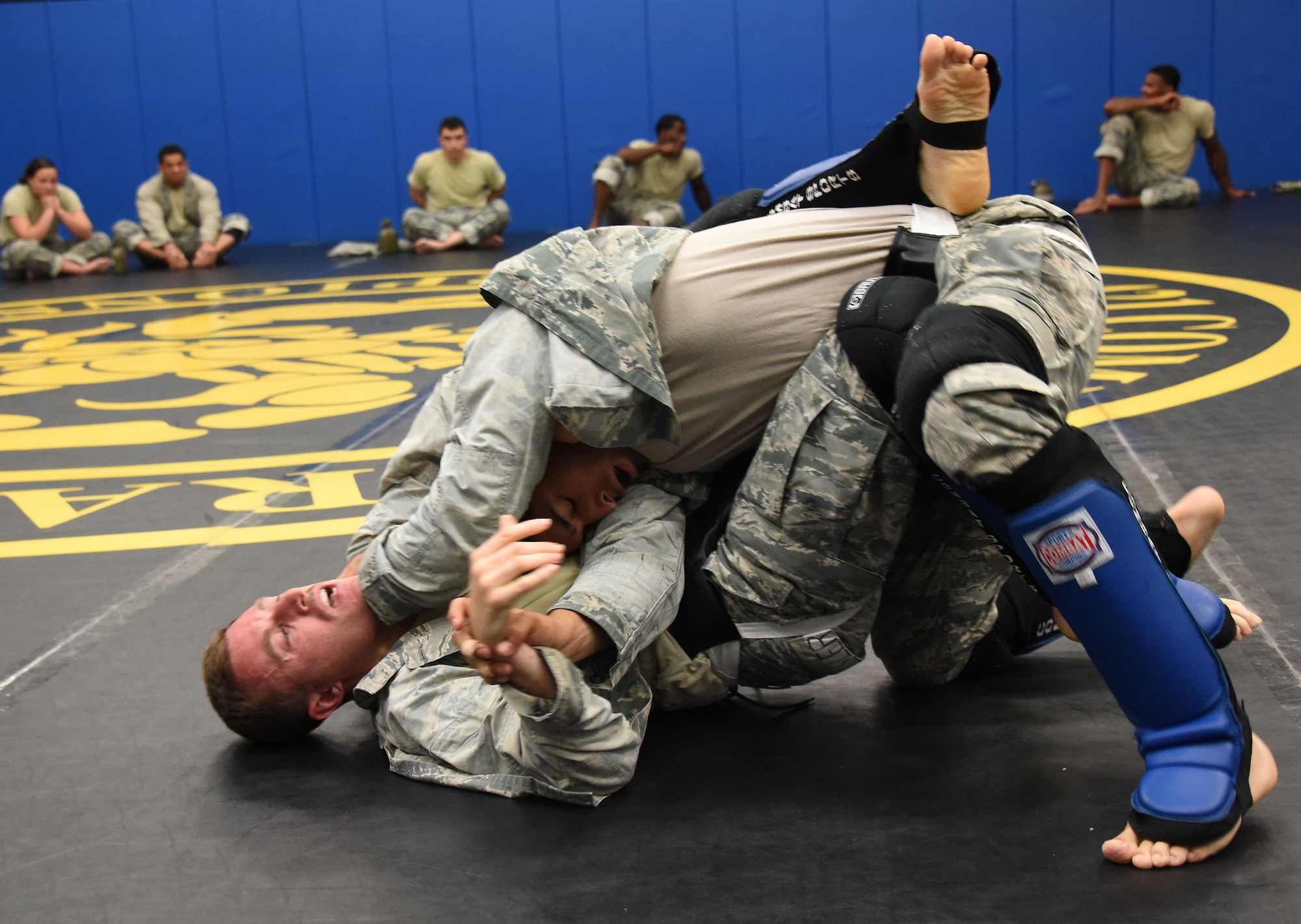 Senior Airman Johnathan Heisler (bottom), 512th Security Forces Squadron reservist, trains in combatives with another trainee during Phoenix Raven training June 15, 2017, at Joint Base McGuire-Dix-Lakehurst, New Jersey. More commonly called "Ravens," this small community of specialized security forces Airmen are trained to detect, deter and counter threats to Air Mobility Command, Air National Guard and Air Force Reserve aircraft. (U.S. Air Force photo/Master Sgt. Jaimie Powell)