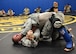 Senior Airman Johnathan Heisler (bottom), 512th Security Forces Squadron reservist, trains in combatives with another trainee during Phoenix Raven training June 15, 2017, at Joint Base McGuire-Dix-Lakehurst, New Jersey. More commonly called 