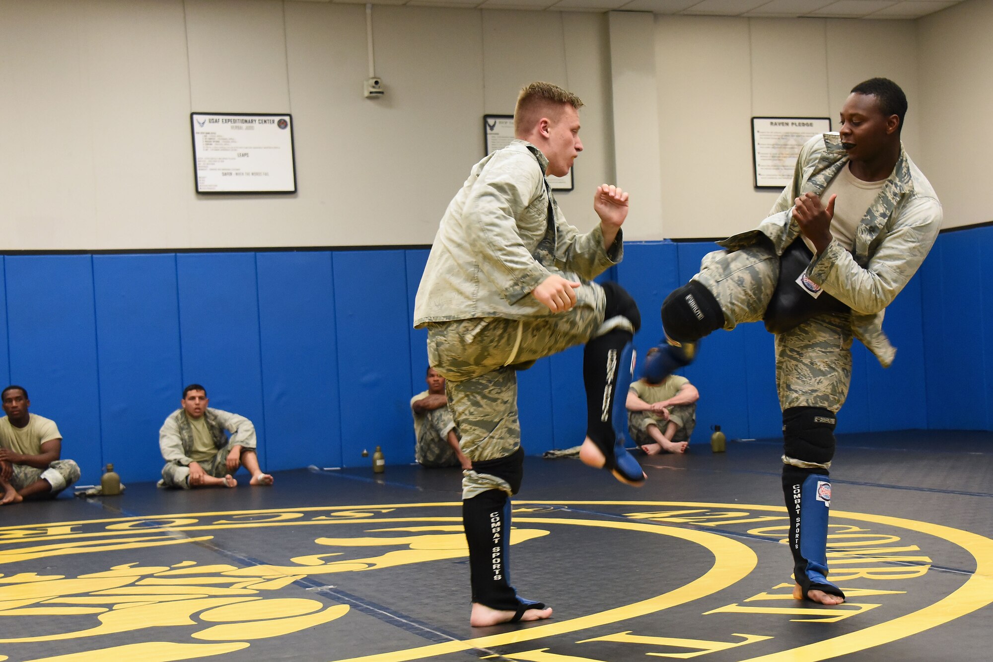 Senior Airman Jerome Scurry (top), 512th Security Forces Squadron reservist, trains in combatives with another trainee during Phoenix Raven training June 15, 2017, at Joint Base McGuire-Dix-Lakehurst, New Jersey. More commonly called "Ravens," this small community of specialized security forces Airmen are trained to detect, deter and counter threats to Air Mobility Command, Air National Guard and Air Force Reserve aircraft. (U.S. Air Force photo/Master Sgt. Jaimie Powell)