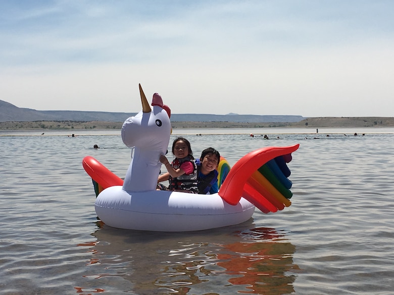 Children enjoy floating at Cochiti Lake's swim beach, June 23, 2017.