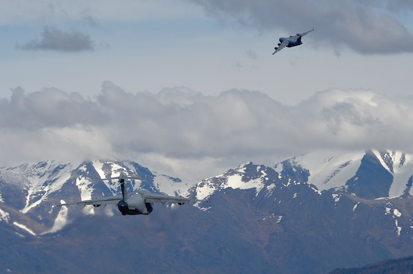 Two U.S. Air Force C-17 Globemaster IIIs take off from Joint Base Elmendorf-Richardson during Red Flag Alaska 16-1, May 10, 2016. Realistic exercises like Red Flag, provide mobility Airmen at JBER an opportunity to train for the Air Force's mission in the far North. It also helps Air Mobility Command develop personal relationships  and build trust with international partners.
 (U.S. Air Force photo/Alejandro Pena)