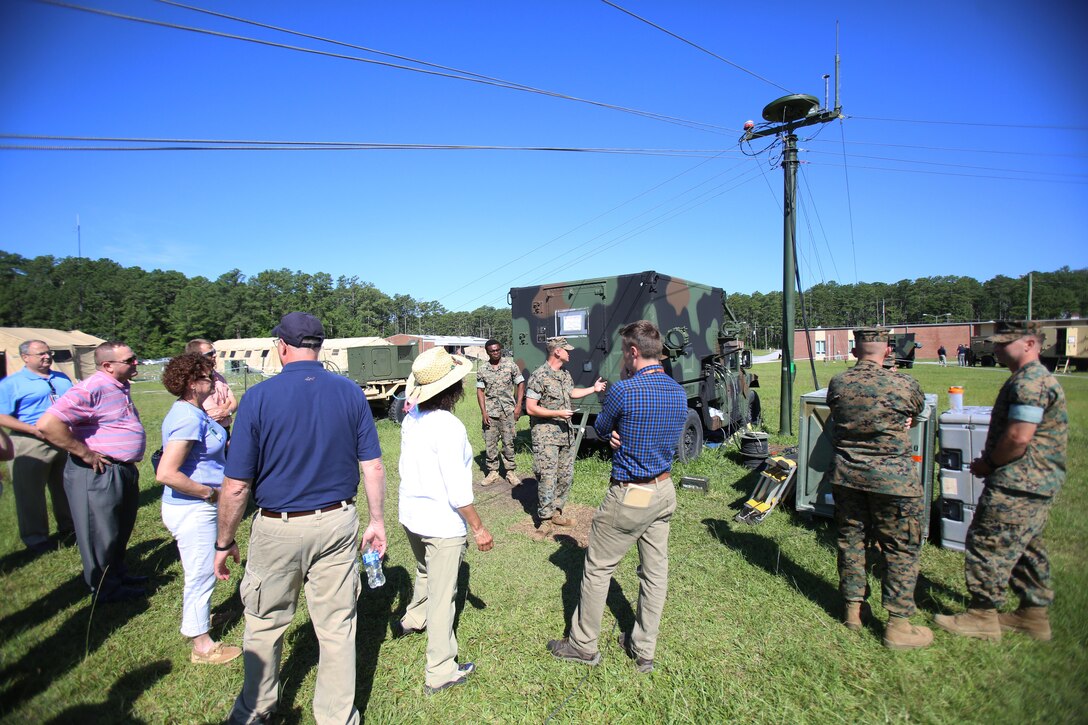Marines assigned to Marine Air Control Squadron 2 showcase the Composite Tracking Network to personnel from Program Executive Officer Land Systems aboard Marine Corps Air Station Cherry Point, N.C., June 28, 2017. The CTN interfaces with the Ground/Air Task Oriented Radar and the Common Aviation Command and Control System to establish a wider radar range and more accurate data than previous systems. The ability of the three systems to integrate with one another provides faster and more accurate data to Marine Air-Ground Task Force commanders, allowing them to maintain better situational awareness, and improving their decision making ability. MACS-2 is assigned to Marine Air Control Group 28, 2nd Marine Aircraft Wing. (U.S. Marine Corps Photo by Pfc. Skyler Pumphret/ Released)