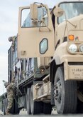 Spc. Jorge MillerGarcia, a native of Sheboygan, Wis., top, and Army Staff Sgt. Igoa Lilii, a native of Garden Grove, Calif., both assigned to the 109th Transportation Company "Muleskinners", 17th Combat Sustainment Support Battalion, U.S. Army Alaska, secure equipment on a flat bed trailer at Joint Base Elmendorf-Richardson, Alaska, June 28, 2017, in support of a U.S. Air Force exercise. USARAK is at the forefront  of protecting America’s interests in the Asia-Pacific region, and is one of the U.S. military’s most centrally located power projection platforms that benefits from joint training opportunities.