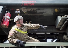 Army Pvt. Aaron McCay, a native of Colorado Springs, Colo., assigned to the 109th Transportation Company "Muleskinners", 17th Combat Sustainment Support Battalion, U.S. Army Alaska, asks a fellow soldier to hand him a breaker bar while securing a vehicle to a flat bed trailer on Joint Base Elmendorf-Richardson, Alaska, June 28, 2017, in support of a U.S. Air Force exercise. USARAK is at the forefront  of protecting America’s interests in the Asia-Pacific region, and is one of the U.S. military’s most centrally located power projection platforms that benefits from joint training opportunities.