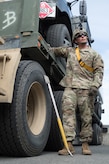 Army Staff Sgt. Luke Miller, a native of Honolulu, assigned to the 109th Transportation Company "Muleskinners", 17th Combat Sustainment Support Battalion, U.S. Army Alaska, takes a short break after loading vehicles and equipment onto a flat bed trailer on Joint Base Elmendorf-Richardson, Alaska, June 28, 2017, in support of a U.S. Air Force exercise. USARAK is at the forefront  of protecting America’s interests in the Asia-Pacific region, and is one of the U.S. military’s most centrally located power projection platforms that benefits from joint training opportunities.