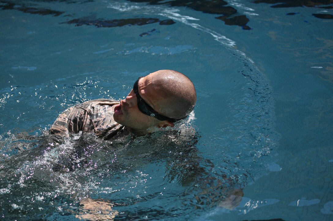 U.S. Air Force Tech. Sgt. David Troche from the New Jersey Air National Guard's 108th Security Forces Squadron swims the 100 meter challenge during a German Armed Forces Badge for Military Proficiency test at Joint Base McGuire-Dix-Lakehurst, N.J., June 13, 2017. The test included an 1x10-meter sprint, flex arm hang, 1,000 meter run, 100 meter swim in Military Uniform, marksmanship, and a timed foot march. (U.S. Air National Guard photo by Master Sgt. Matt Hecht/Released)