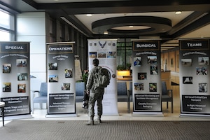 U.S. Air Force Capt. Tiffany Winston, 633rd Medical Operations Squadron emergency medicine physician, looks at visual material provided by the Special Operations Surgical Teams at Joint Base Langley-Eustis, Va., June 23, 2017. The SOST are specialized surgical teams, fully trained and equipped to operate in hostile or austere environments the front lines of battle and crises in support special operations missions. (U.S. Air Force photo/Staff Sgt. Brittany E.N. Murphy)