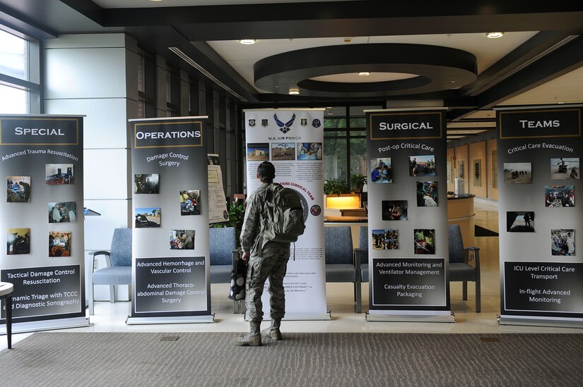 U.S. Air Force Capt. Tiffany Winston, 633rd Medical Operations Squadron emergency medicine physician, looks at visual material provided by the Special Operations Surgical Teams at Joint Base Langley-Eustis, Va., June 23, 2017. The SOST are specialized surgical teams, fully trained and equipped to operate in hostile or austere environments the front lines of battle and crises in support special operations missions. (U.S. Air Force photo/Staff Sgt. Brittany E.N. Murphy)