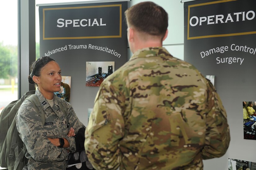 U.S. Air Force Capt. Tiffany Winston, 633rd Medical Operations Squadron emergency medicine physician, talks with U.S. Air Force Tech. Sgt. Sean Patterson, Special Operations Surgical Team member, at Joint Base Langley-Eustis, Va., June 23, 2017. SOSTs are specialized surgical teams that provide four exclusive medical capabilities, to include advanced trauma resuscitation, tactical damage control surgery, post-operative critical care and critical care evacuation. (U.S. Air Force photo/Staff Sgt. Brittany E.N. Murphy)