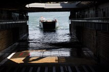 Marines and sailors work together to bring a Humvee aboard the USS Whidbey Island (LSD-41), June 13, 2017. Military personnel across the Department of Defense are making preparations for Sail Boston 2017, to showcase the vast capabilities of the United States amphibious forces, to the public. Some of the vehicles and weapons on display will include a Marine Corps Humvee, a U.S. Navy MH-53E Sea Dragon, and a wide array of weapons systems. (U.S. Marine Corps photo by Lance Cpl. Jailine L. Martinez)