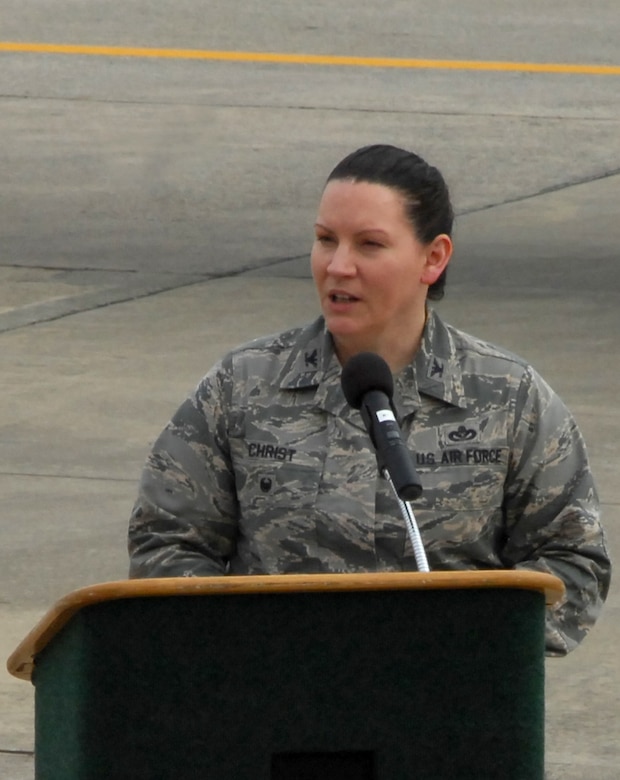 Col. Sarah Christ, 78th Air Base Wing vice commander, addresses a crowd of people during a ceremony marking the early completion of work on an RQ-4 Global Hawk. Robins Air Force Base is the first and only installation to have a building-based Launch and Recovery Element, allowing the aircraft to take off and land from this location. This is also the first time a Global Hawk has flown into an Air Force air logistics complex. Warner Robins Air Logistics Complex maintenance professionals meticulously painted the aircraft to prevent corrosion. While a programmed depot maintenance requirement for Global Hawk has not been established, the Air Force recognizes that having an organic maintenance capability for Global Hawk enhances our ability to manage the fleet and keep this resource flying. (U.S. Air Force photo/ED ASPERA)
