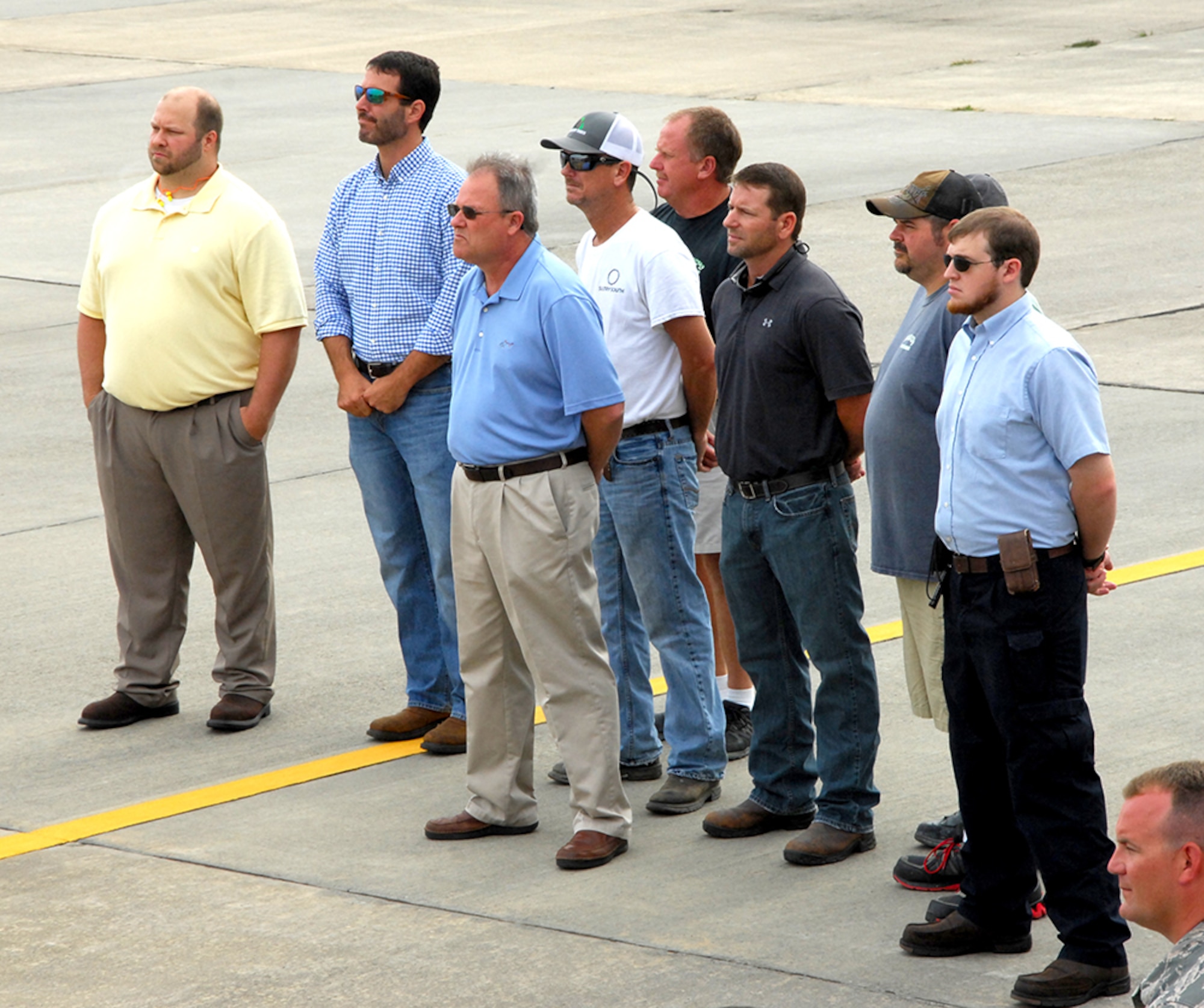 A group of Team Robins employees attend a June 29 ceremony marking the end of work done to an RQ-4 Global Hawk at the Warner Robins Air Logistics Complex. Robins Air Force Base is the first and only installation to have a building-based Launch and Recovery Element, allowing the aircraft to take off and land from this location. This is also the first time a Global Hawk has flown into an Air Force air logistics complex. Warner Robins Air Logistics Complex maintenance professionals meticulously painted the aircraft to prevent corrosion. While a programmed depot maintenance requirement for Global Hawk has not been established, the Air Force recognizes that having an organic maintenance capability for Global Hawk enhances our ability to manage the fleet and keep this resource flying. (U.S. Air Force photo/ED ASPERA