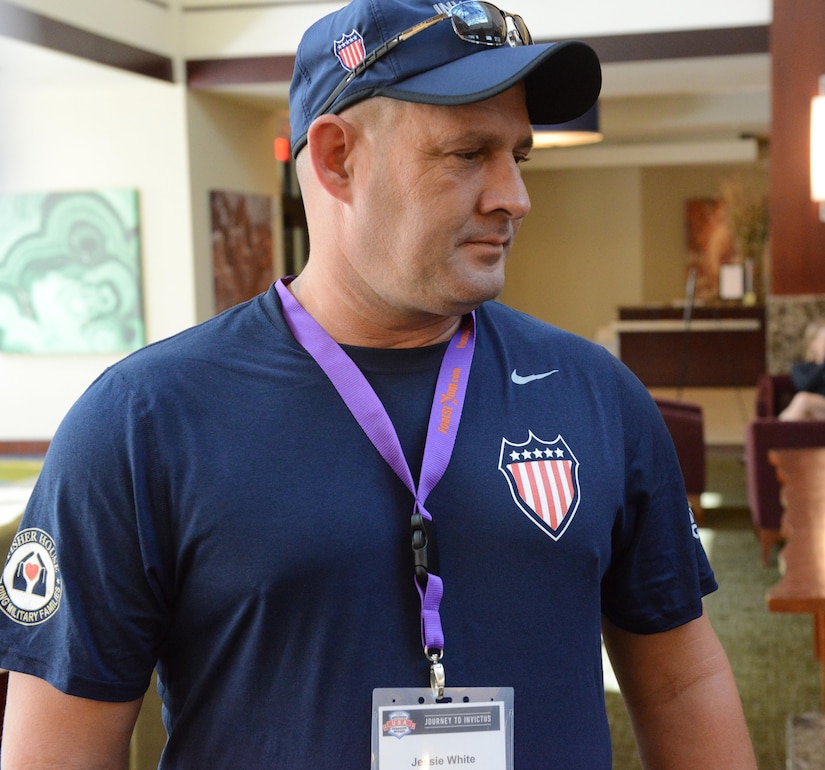 Jessie White, a retired Army staff sergeant, arrives in London to compete in the Invictus Games Sept. 5, 2014. White now serves as the coach for the Army and Navy archery teams and will oversee the archery events during the Warrior Games in Chicago, June 30-July 8, 2017. DoD photo by David Vergun