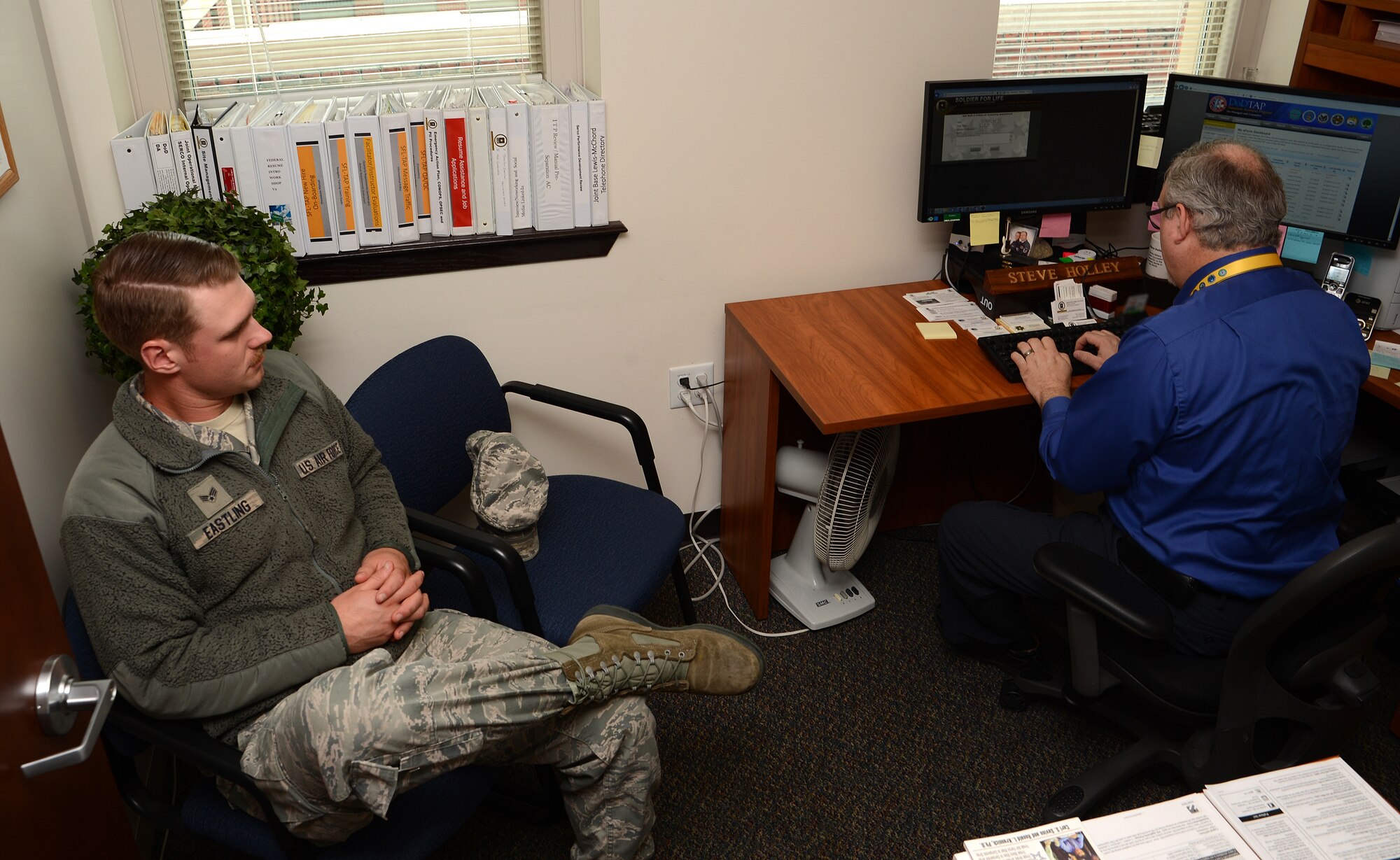 Senior Airman Ethan Eastling, 62nd Aircraft Maintenance Squadron aircraft maintainer, receives career counseling from Steve Holley, Service Member for Life Transition Assistance Program unit outreach team member, June 27, 2017, at Joint Base Lewis-McChord, Wash.  The SFL TAP provides relevant and practical tools and services to help transitioning service members reintegrate into the civilian workforce. (U.S. Air Force photo/Senior Airman Jacob Jimenez)    