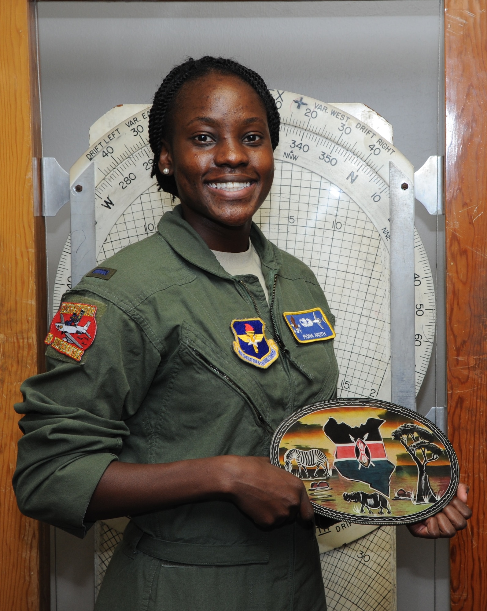 First Lt. Fiona Akoth, 14th Student Squadron Student Pilot, holds a ceramic Kenyan decoration June 16, 2017, at Columbus Air Force Base, Mississippi. Akoth has always wanted to be a pilot and is excited to be in the Air Force. (U.S. Air Force photo by Airman 1st Class Beaux Hebert)