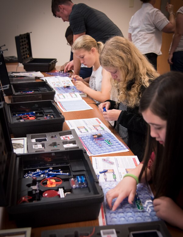 170619-N-GB257-001 CHARLESTON; S.C. (June 19, 2017)  Students build robots at the fifth annual Cyber Security Summer Camp hosted by Space and Naval Warfare Systems Center (SSC) Atlantic at Burke High School June 19-23. More than 30 SSC Atlantic employees volunteered along with others from Trident Technical College, instructing more than 135 students from Charleston, Berkeley and Dorchester county school districts. (U.S. Navy photo by Joe Bullinger/Released)