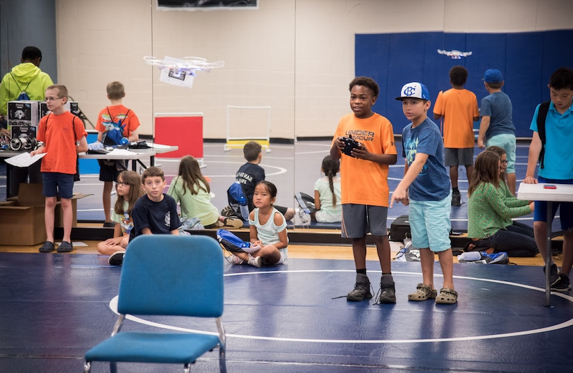 Campers remotely control a drone at the Space and Naval Warfare Systems Center (SSC) Atlantic-hosted -fifth annual Cyber Security Summer Camp at Burke High School June 19-23. More than 30 SSC Atlantic employees volunteered along with others from Trident Technical College, instructing more than 135 students from Charleston, Berkeley and Dorchester county school districts.
