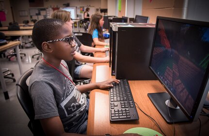 170620-N-GB257-001 CHARLESTON; S.C. (June 20, 2017)  A student works on a computer during Space and Naval Warfare Systems Center (SSC) Atlantic’s fifth annual Cyber Security Summer Camp, held at Burke High School June 19-23. More than 30 SSC Atlantic employees volunteered along with others from Trident Technical College, instructing more than 135 students from Charleston, Berkeley and Dorchester county school districts.