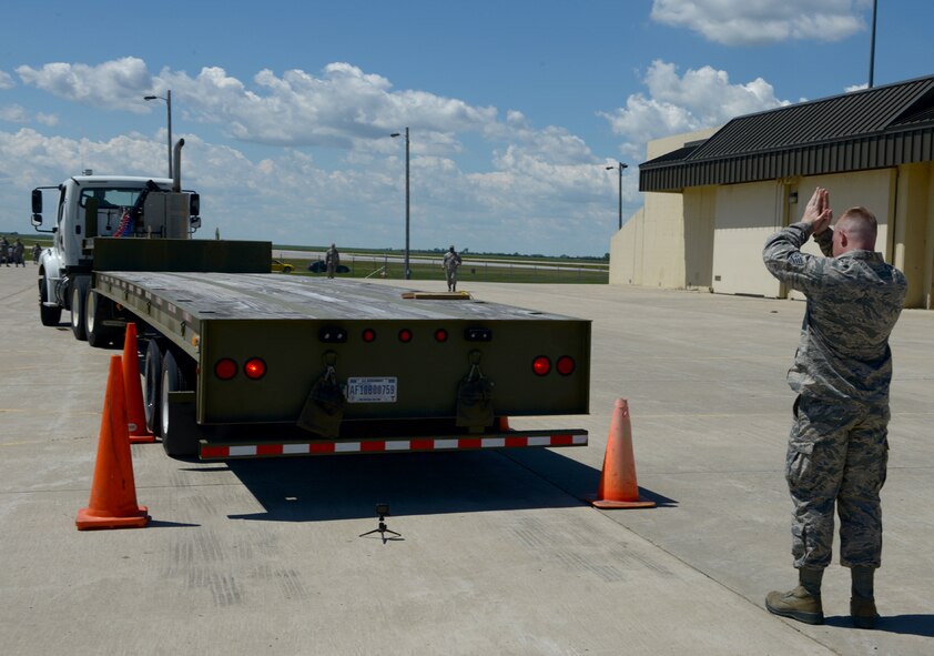 Staff Sgt. Brenton Gibbs, 5th Munitions Squadron munitions inspector, guides a truck through cones during Global Strike Challenge at Minot Air Force Base, N.D., June 19, 2017. The vehicle rodeo was part of many events during Global Strike Challenge. (U.S. Air Force Photo by Staff Sgt. Chad Trujillo)