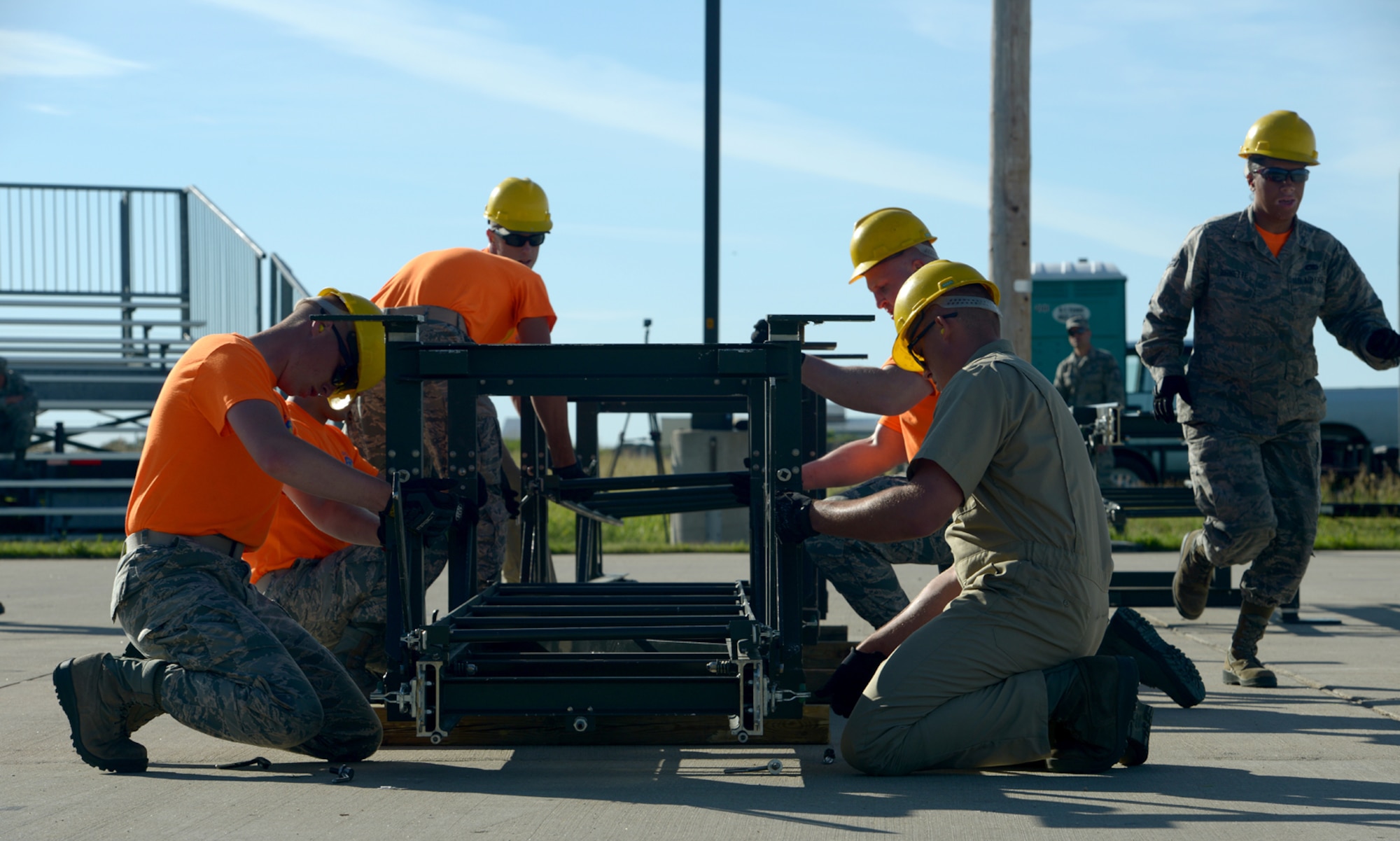 Airmen from the 5th Munitions Squadron practice assembling a munitions assembly conveyor at Minot Air Force Base, N.D., June 20, 2017. Airmen geared up for Global Strike Challenge which is a competition across wings in Global Strike Command. (U.S. Air Force Photo by Staff Sgt. Chad Trujillo)