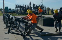 Airmen from the 5th Munitions Squadron practice assembling a munitions assembly conveyor at Minot Air Force Base, N.D., June 20, 2017. Airmen geared up for Global Strike Challenge which is a competition across wings in Global Strike Command. (U.S. Air Force Photo by Staff Sgt. Chad Trujillo)