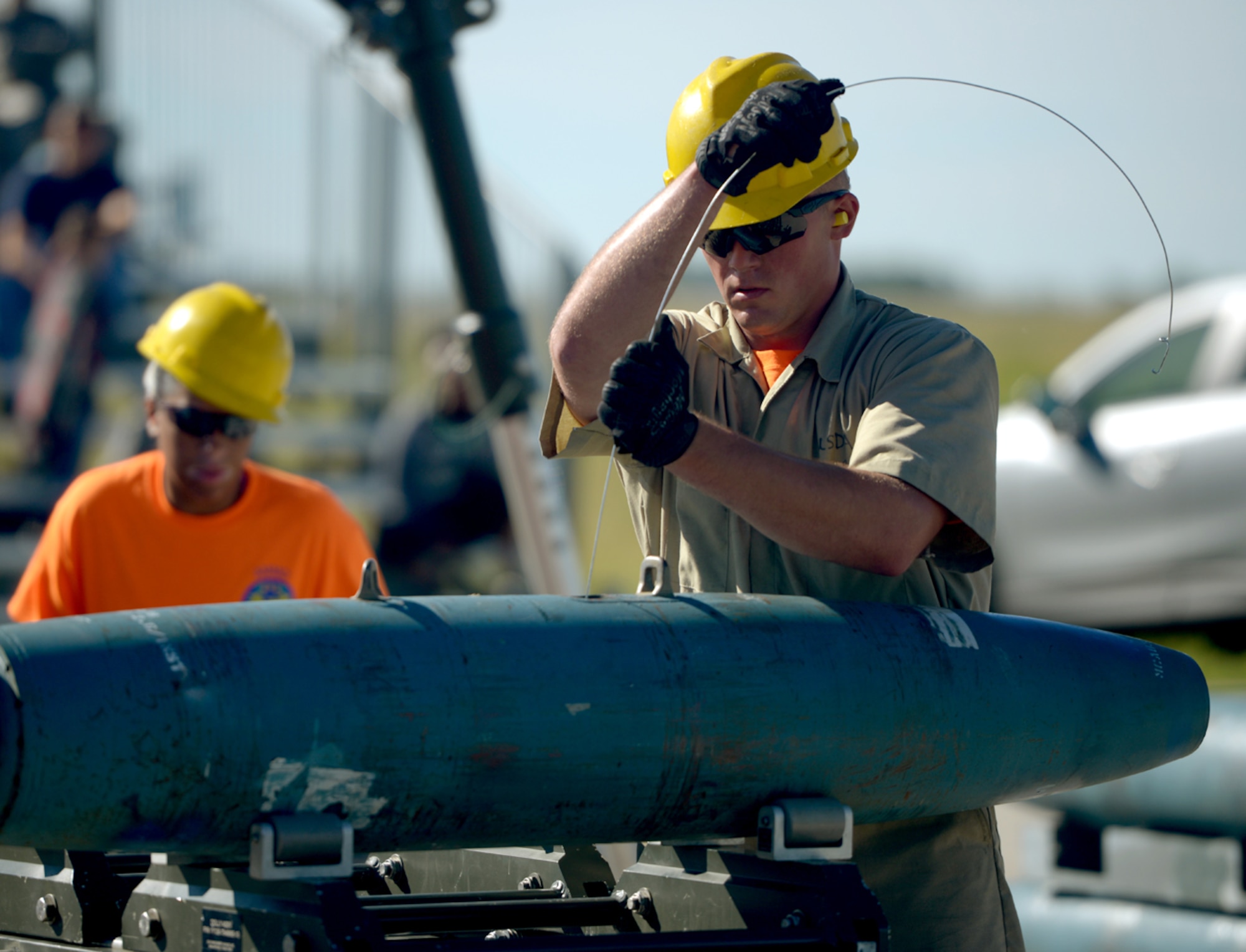 Airman 1st Class Colin Loehr, 5th Munitions Squadron munitions specialist, assembles a BDU-56 bomb at Minot Air Force Base, N.D., June 20, 2017. The Airmen trained for Global Strike Challenge 2017. (U.S. Air Force Photo by Staff Sgt. Chad Trujillo)