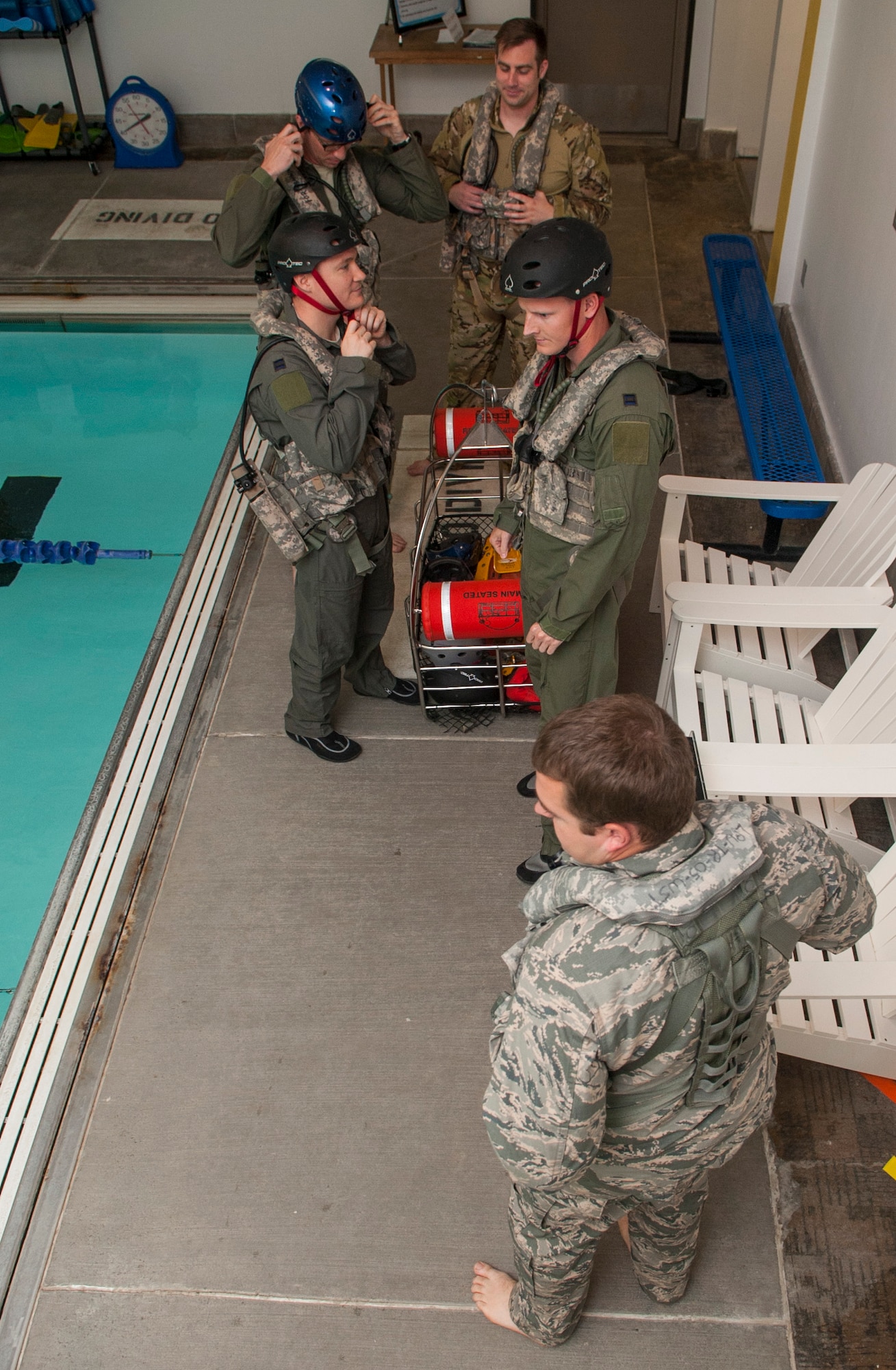 Members of the 54th Helicopter Squadron prepare for underwater egress survival training at Minot Air Force Base, N.D., June 22, 2017. The training included demonstrations on how to escape a simulated helicopter crash and properly use common rescue devices. (U.S. Air Force photo by Airman 1st Class Jonathan McElderry)