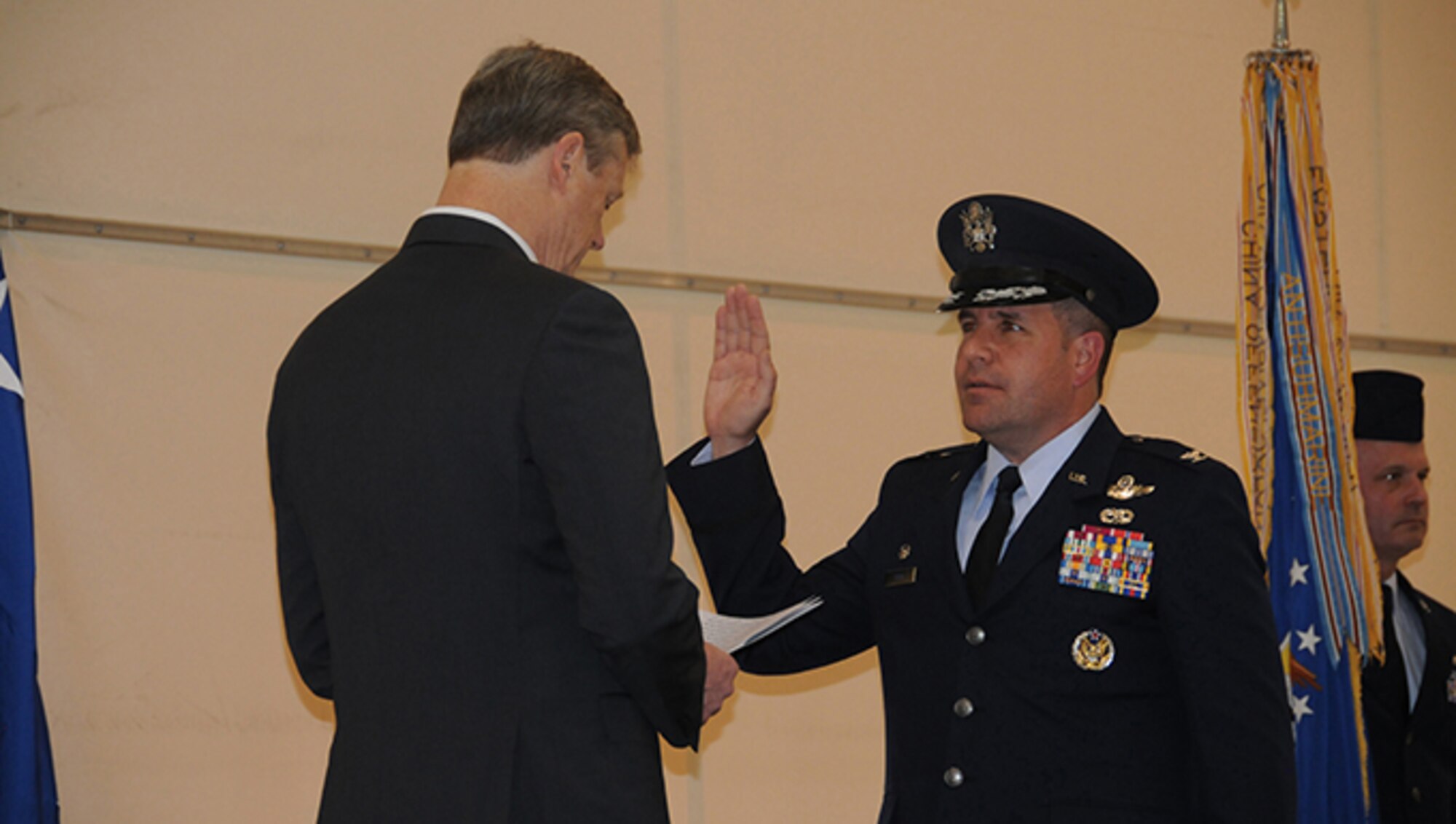 Col. James M. Suhr assumed command of the 104th Fighter Wing during a change of command ceremony held at Barnes Air National Guard Base, March 5, 2017. Governor Charlie Baker personally administered the oath of office officially swearing-in Col. Suhr to the Massachusetts National Guard prior to the Change of Command Ceremony. Col. Suhr is the first active duty commander for the 104th Fighter Wing.  He is a dual status commander as both an active duty and Massachusetts National Guard officer as a part of an initiative known as Total Force Integration. (U.S. Air National Guard Photo by Tech. Sgt. Lindsey Sarah Watson-Kirwin)