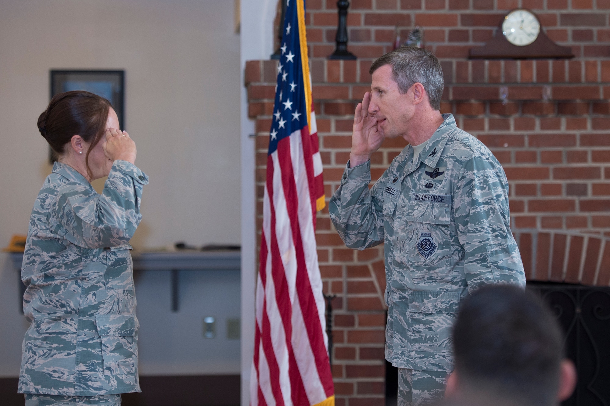 Col. Thomas Kunkel, 23d Wing commander, renders a salute to Lt. Col. Cynthia Kearley, 23d Wing Staff Judge Advocate and Leadership Moody, Emerge Moody cadre member, for an exceptional job during Moody’s first 2017 Emerge Moody, Leadership Moody  installment at a graduation ceremony, June 23, 2017, at Moody Air Force Base, Ga. Kearley was coined for her efforts in spearheading the programs which were designed to enhance  participant’s Air Force networks and their continued growth as Air Force leaders throughout their career. (U.S. Air Force photo by Senior Airman Greg Nash)