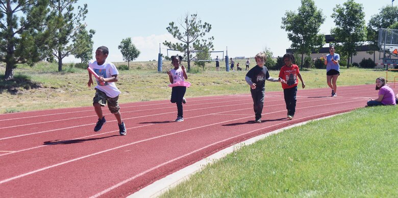 The Summer Enrichment Program participants race at Schriever Air Force Base, Colorado, Monday, June 26, 2017. The program spans two weeks and provides children with activities during their summer break. (U.S. Air Force photo/Senior Airman Arielle Vasquez)