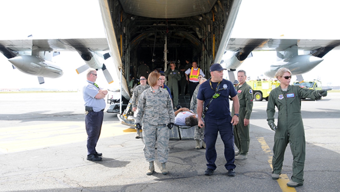 Twelve airmen from the 104th Medical Group and seven airmen from the 102nd Medical Group participated in a mass casualty training at the Earhart Terminal at Logan Airport in Boston Massachusetts.  Also present were members of the 139th Aeromedical Evacuation Squadron, part of the 109th Airlift Wing at Stratton Air National Guard Base, Scotia NY, who came in on the C-130 where most of the exercise took place.  (U.S. Air National Guard Photos by Tech. Sgt. Lindsey Sarah Watson-Kirwin)