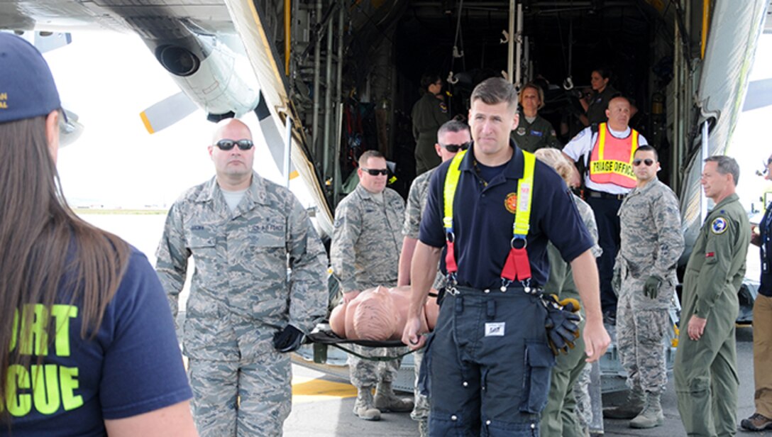 Twelve airmen from the 104th Medical Group and seven airmen from the 102nd Medical Group participated in a mass casualty training at the Earhart Terminal at Logan Airport in Boston Massachusetts.  Also present were members of the 139th Aeromedical Evacuation Squadron, part of the 109th Airlift Wing at Stratton Air National Guard Base, Scotia NY, who came in on the C-130 where most of the exercise took place.  (U.S. Air National Guard Photos by Tech. Sgt. Lindsey Sarah Watson-Kirwin)
