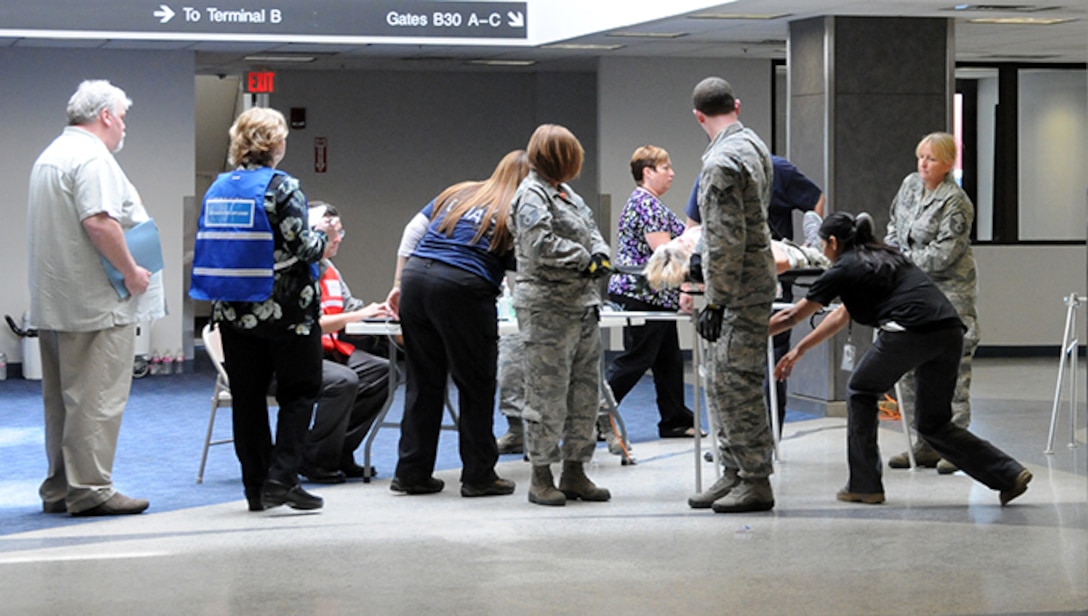 Twelve airmen from the 104th Medical Group and seven airmen from the 102nd Medical Group participated in a mass casualty training at the Earhart Terminal at Logan Airport in Boston Massachusetts.  Also present were members of the 139th Aeromedical Evacuation Squadron, part of the 109th Airlift Wing at Stratton Air National Guard Base, Scotia NY, who came in on the C-130 where most of the exercise took place.  (U.S. Air National Guard Photos by Tech. Sgt. Lindsey Sarah Watson-Kirwin)