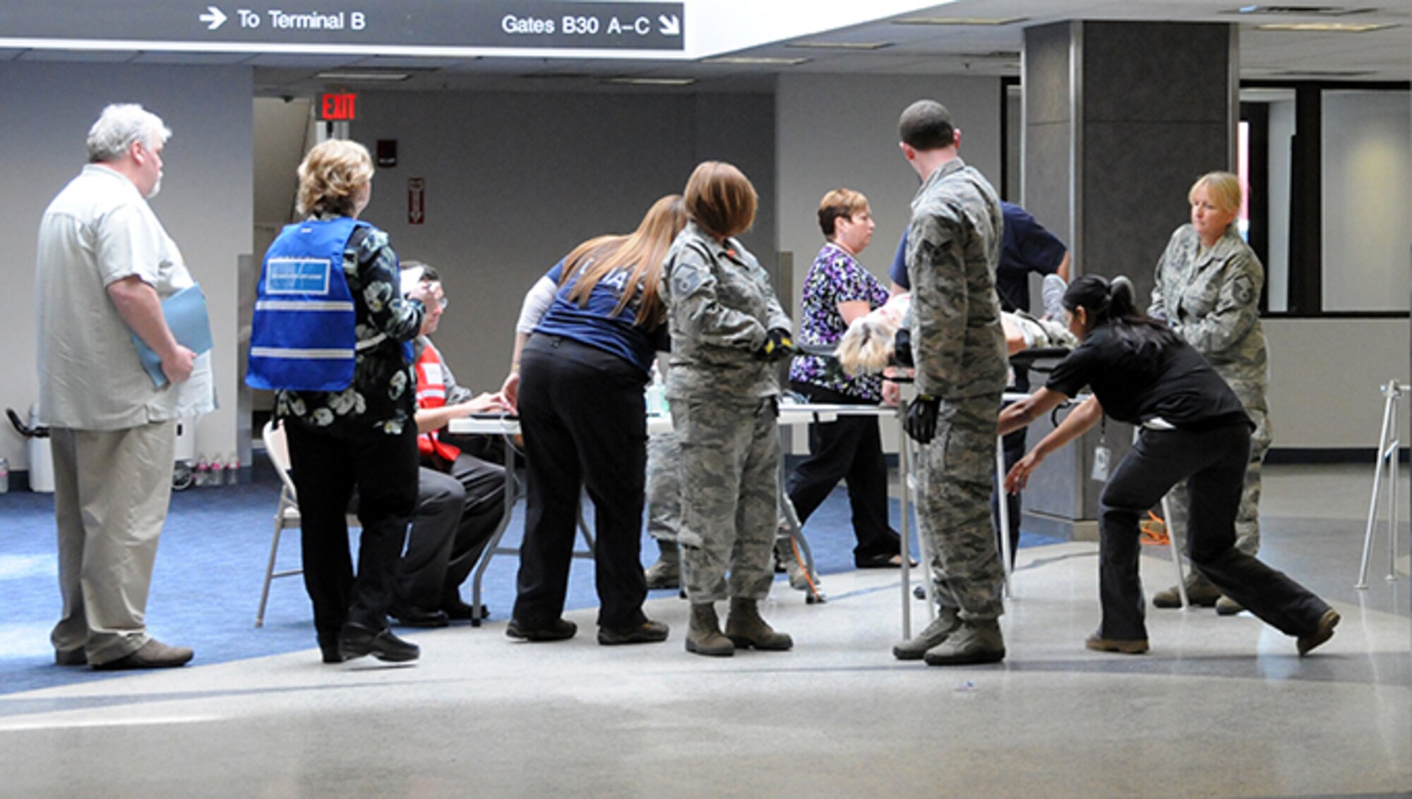 Twelve airmen from the 104th Medical Group and seven airmen from the 102nd Medical Group participated in a mass casualty training at the Earhart Terminal at Logan Airport in Boston Massachusetts.  Also present were members of the 139th Aeromedical Evacuation Squadron, part of the 109th Airlift Wing at Stratton Air National Guard Base, Scotia NY, who came in on the C-130 where most of the exercise took place.  (U.S. Air National Guard Photos by Tech. Sgt. Lindsey Sarah Watson-Kirwin)