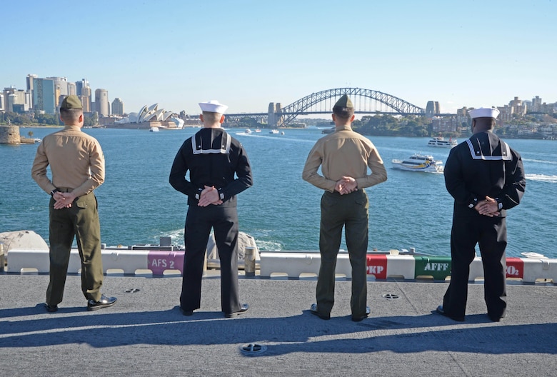 Sailors and Marines man the rails as the amphibious assault ship USS Bonhomme Richard (LHD 6) pulls into the Sydney Harbor as part of a port visit, June 29,2017. Bonhomme Richard is in Sydney to advance U.S. – Australian relations ahead of the bilateral training exercise Talisman Saber. During the visit, Bonhomme Richard will host a reception, ships tours and experience the culture of the historic city. 