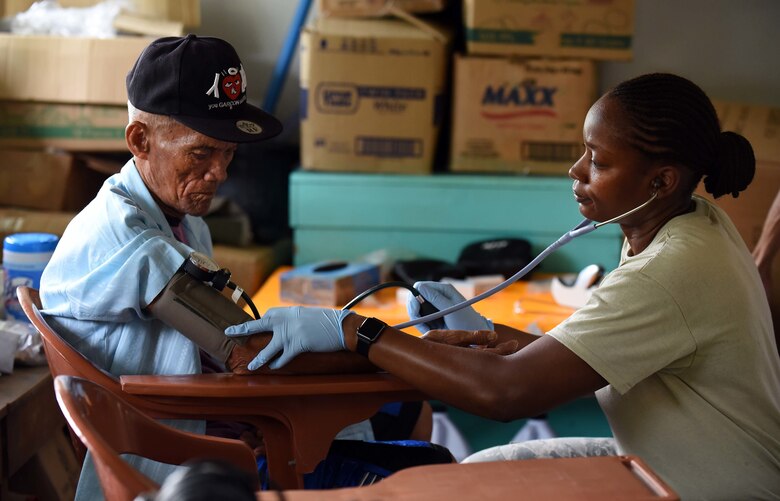 U.S. Air Force Tech. Sgt. Natasha Smith, medical technician with the 15th Medical Operation Squadron, Joint Base Pearl Harbor-Hickam, Hawaii, measures vitals of a man from Bogo City during Pacific Angel 2017 in Northern Cebu Province, Philippines, June 26, 2017. PACANGEL participants from six different nations work together with local nongovernmental organizations to administer medical care, including general health, optometry, dental, physical therapy and pediatrics, to the people of Northern Cebu Province. (U.S. Air Force photo by Tech. Sgt. Jeff Andrejcik)