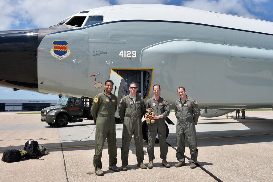 Aircrew members pose with Hugh Trenchard, a special teddy bear, following a training flight on an RC-135 here June 29. Hugh is an honorary member of the British Royal Air Force and has been flying on aircraft all across the U.S. this year to commemorate the 100th anniversary of the Royal Air Force in 1918 and also the U.S. Air Force 70th anniversary this year. (U.S. Air Force photo by Charles Haymond)