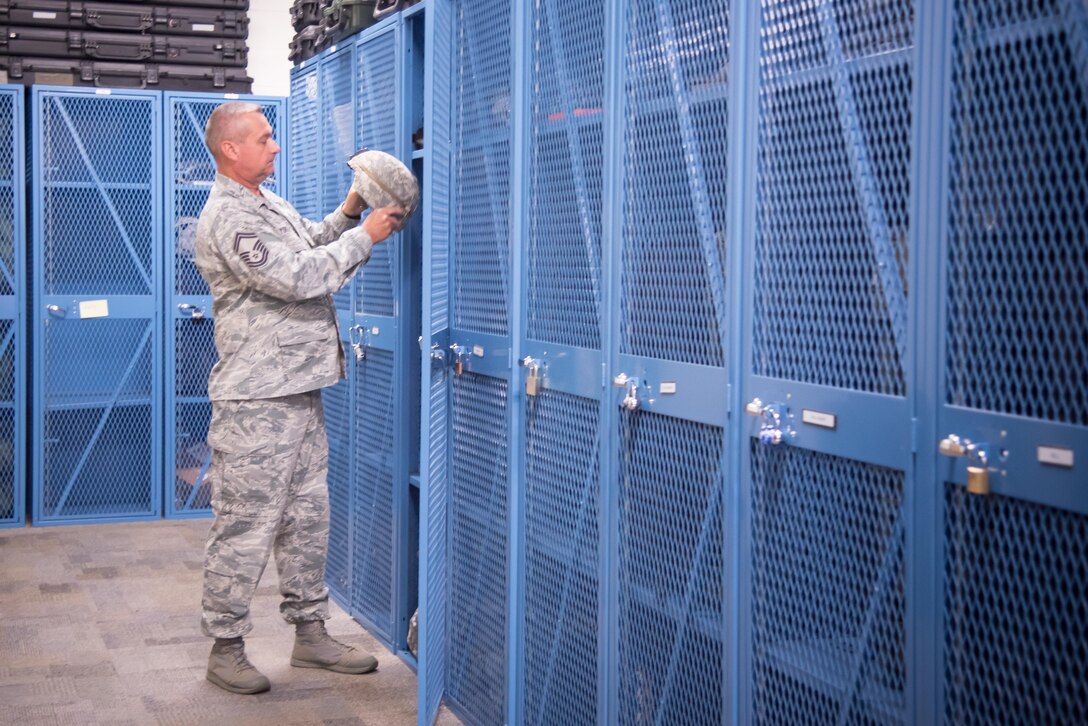 Senior Master Sergeant Ronal Yokley, 403rd Security Force Squadron operations superintendent, inspects equipment June 27, 2017 at Keesler Air Force Base, Mississippi.(U.S. Air Force photo/Staff Sgt. Heather Heiney)