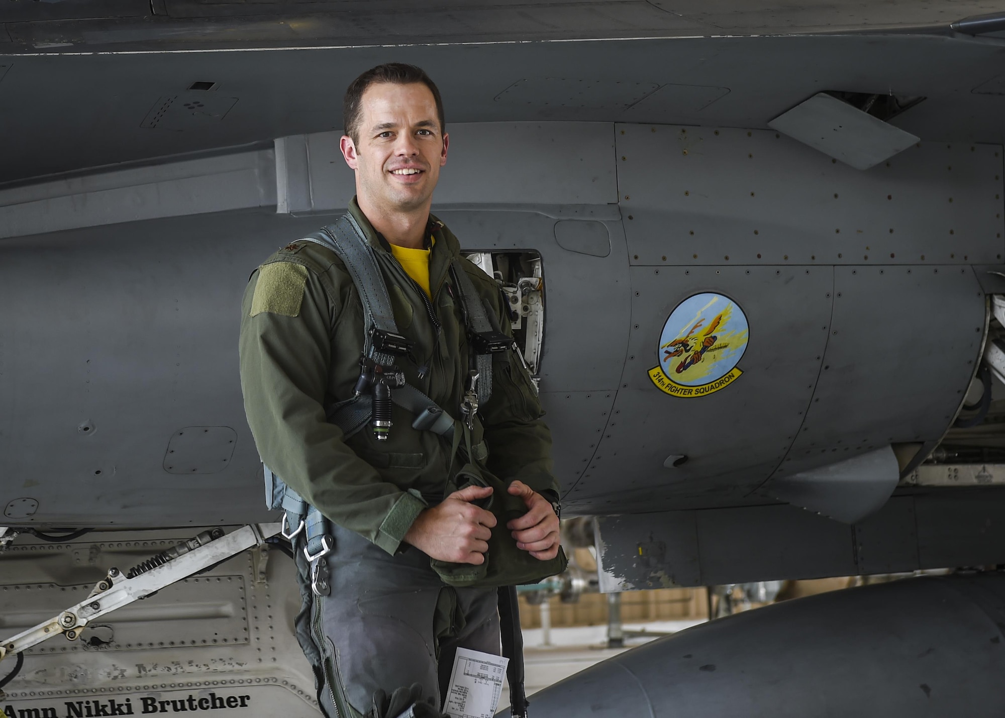 Maj. John R. Widmer, 314th Fighter Squadron flight commander and an F-16 instructor pilot, poses for a photo prior to flying in an F-16 Fighting Falcon at Holloman Air Force Base, N.M. June 23, 2017. Widmer was recently recognized as the Air Force’s Fighter Instructor Pilot of the Year for his exemplary performance in and out of the jet. (U.S. Air Force photo by Airman 1st Class Alexis Docherty)