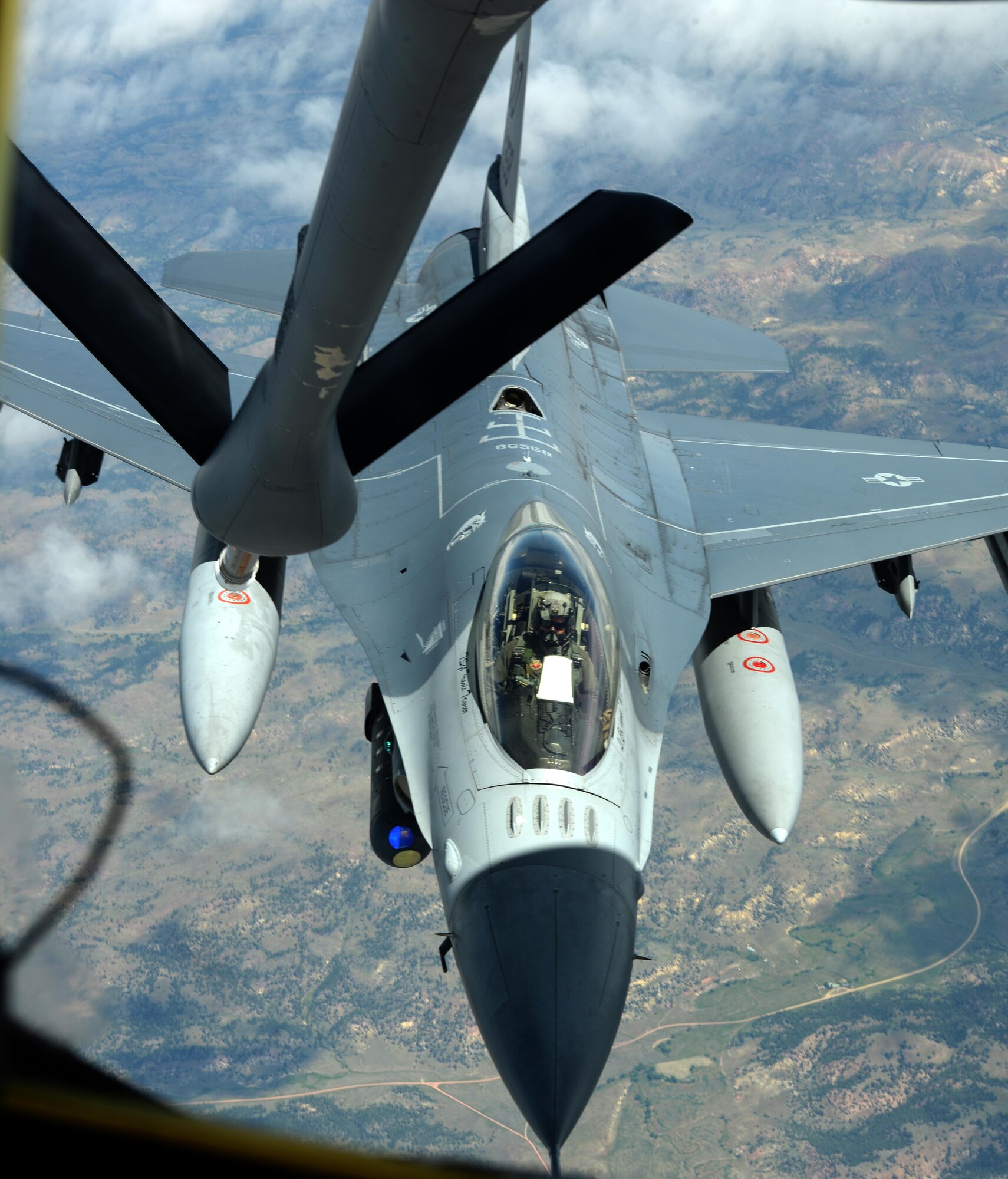 An F-16 Fighting Falcon, assigned to the 175th Fighter Squadron, Joe Foss Field, Air National Guard Station, Sioux Falls, S.D., is refueled by a KC-135 Stratotanker, assigned to the 18th Air Refueling Squadron, McConnell Air Force Base, Kan., during exercise Combat Raider near Ellsworth AFB, S.D., June 28, 2017. Over 20 aircraft participated in the joint exercise from eight military units throughout the United States. (U.S. Air force photo by Airman 1st Class Thomas Karol)