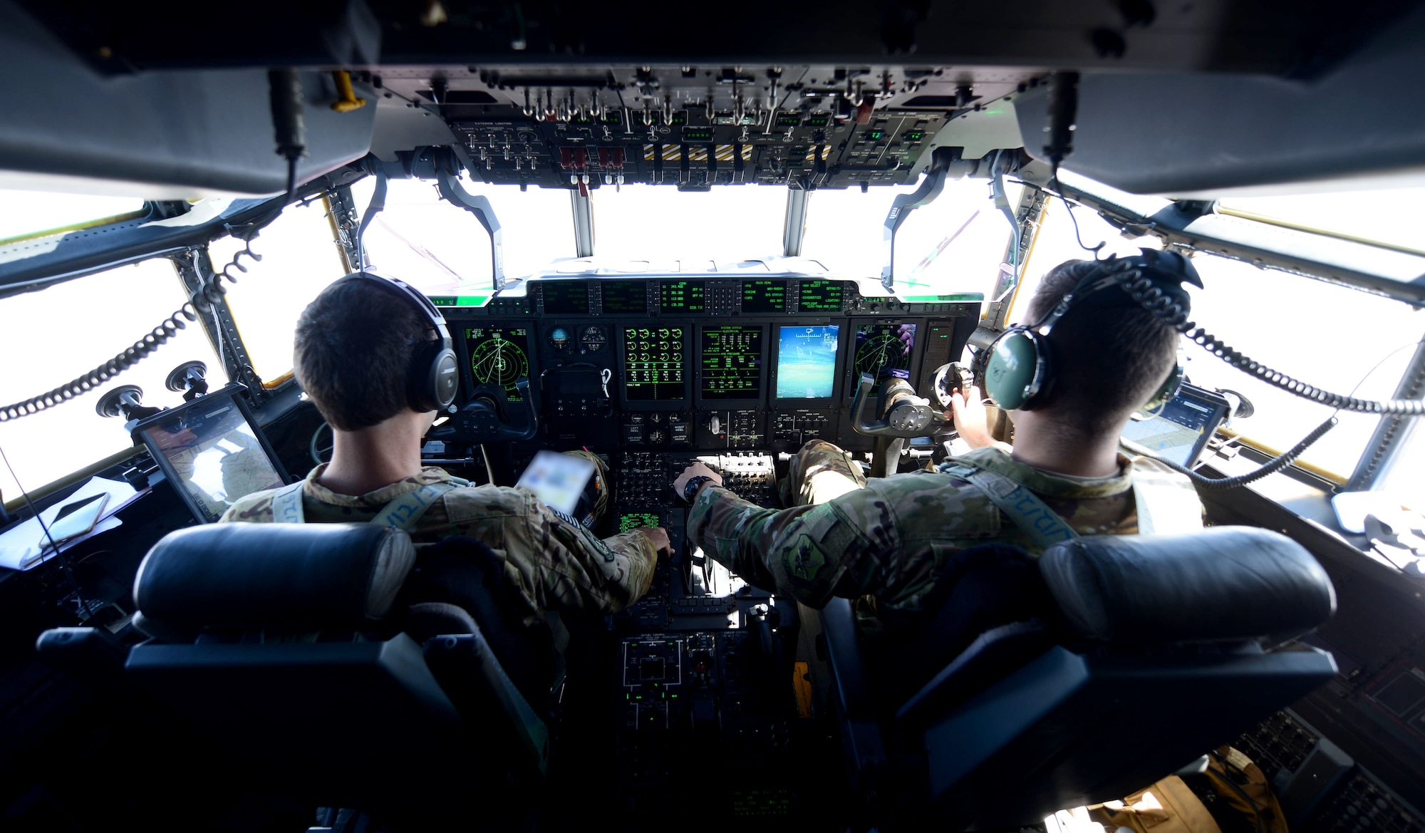 Capts. Carl Price and Chisom Ezeoke, C-130 Super Hercules pilots assigned to the 71st Rescue Squadron, Moody Air Force Base, Ga., fly as part of exercise Combat Raider near Ellsworth AFB, S.D., June 28, 2017. The crew trained with eight other military units in realistic air-to-air, air-to-ground and combat search and rescue missions. (U.S. Air Force photo by Airman 1st Class Donald C. Knechtel)