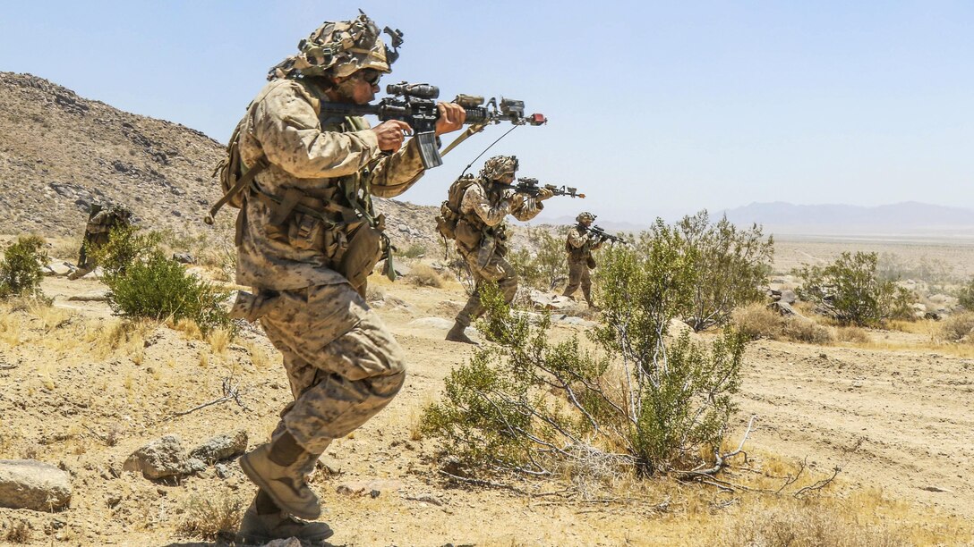 Marines maneuver along the National Training Center’s Brown Pass during an exercise with soldiers at Fort Irwin, Calif., June 28, 2017. The Marines are assigned to the 2nd Battalion, 4th Marine Regiment. Army photo by Pfc. Austin Anyzeski