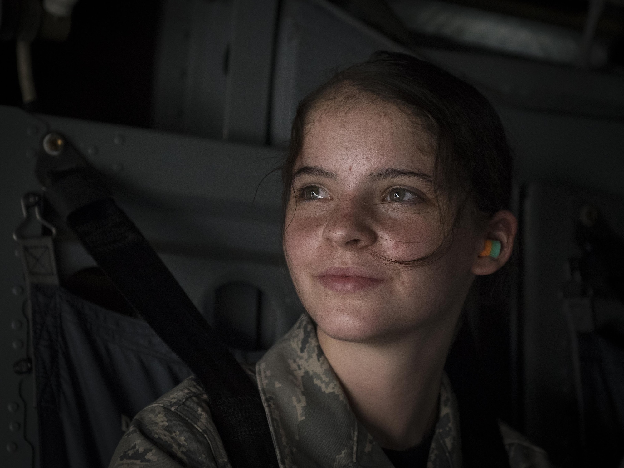 A Junior ROTC cadet scans the sky during an 8th Special Operations Squadron CV-22 Osprey tiltrotor aircraft flight above northwest Florida, June 27, 2017. More than 55 JROTC cadets from nearby high schools flew in a CV-22 and a 15th SOS MC-130H Combat Talon II as part of a JROTC familiarization flight. (U.S. Air Force photo by Airman 1st Class Joseph Pick)