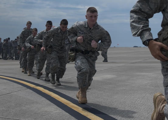 Junior ROTC cadets sprint toward a 15th Special Operations Squadron MC-130H Combat Talon II at Hurlburt Field, Fla., June 27, 2017. From June 26-30, more than 55 JROTC cadets from nearby high schools visited Hurlburt for Summer Leadership School - a course designed to teach cadets leadership, confidence and other traits as part of a JROTC familiarization flight. (U.S. Air Force photo by Airman 1st Class Joseph Pick)
