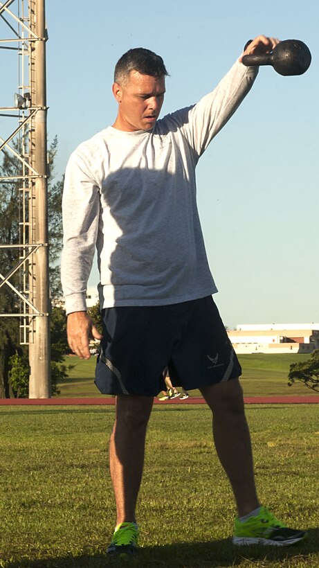 U.S. Air Force MSgt James Prim, 18th Civil Engineering Squadron staff superintendent, participates in a kettle bell station at a Warrior Training Fitness workout June 28, 2017, at the Risner Fitness and Sports Complex, Kadena Air Base, Japan. The workouts help improve the physical resilience for service members and families through a variety of high intensity exercises. (U.S. Air Force photo/Airman 1st Class Greg Erwin)